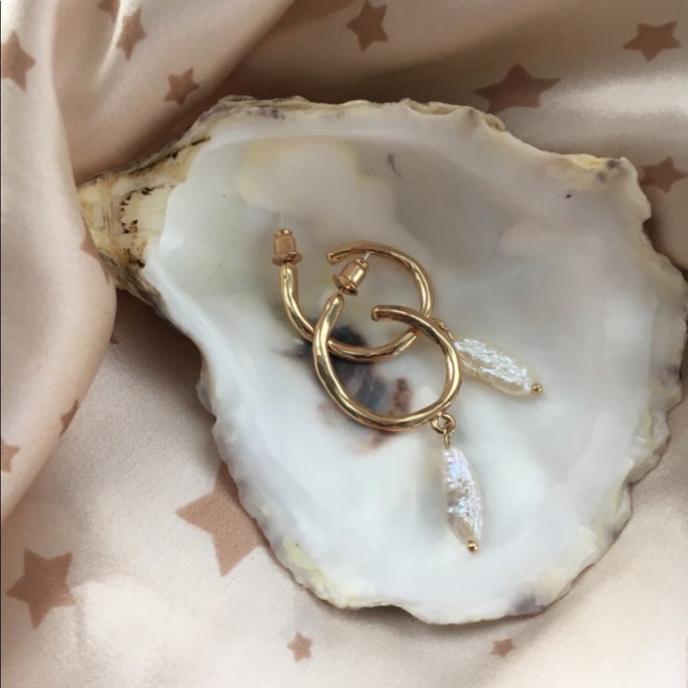 Gold hoop earring with pearl charm